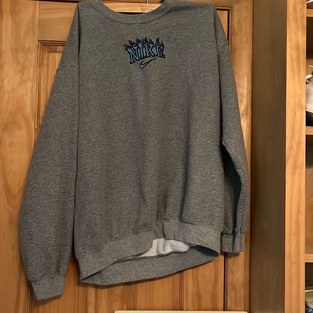 Giladan crewneck with hand sewn Nike flame symbol